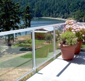 Duradek Supreme Chip Granite Vinyl Decking and Glass Railing with White Posts